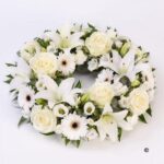 Oval-Centerpiece A set of white roses
