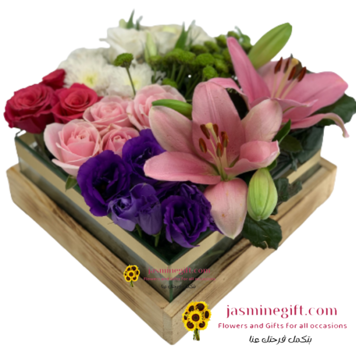 Luxurious flowers in glass a box - Consists of lilies, roses and seasonal Louisiana