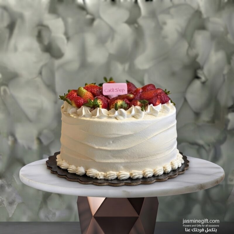Fresh strawberry cake amman from Cake Shop decorated with whipped cream and fresh strawberries on a table.
