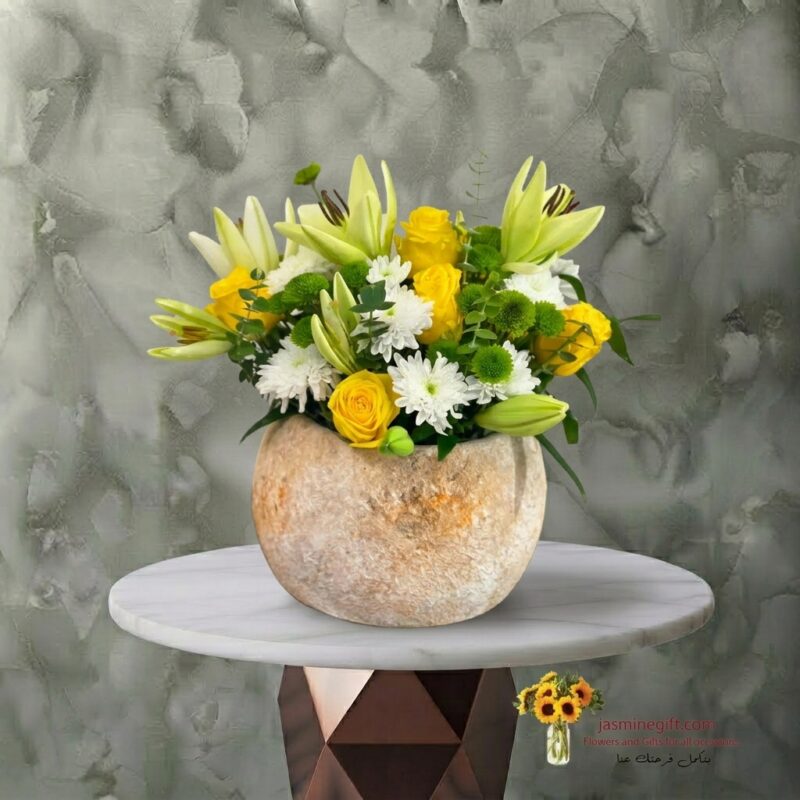 Daily flowers in a stone jar with yellow lilies and roses in Amman-زهور يومية في جار حجري