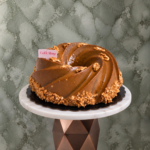 Dates cake amman covered with rich caramel sauce and garnished with walnuts and a chic presentationكيك التمر في عمان