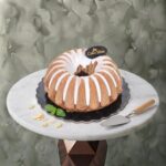 A homemade lemon and berry cake with white glaze from Cake Shop كعكة ليمون وتوت منزلية بصلصة بيضاء من كيك شوب في عمان.in Amman-
