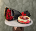 Red rose bouquet with berry cheesecake amman wrapped in elegant black paper alongside a rich berry cheesecake.باقة ورود حمراء مع تشيز كيك التوت في عمان