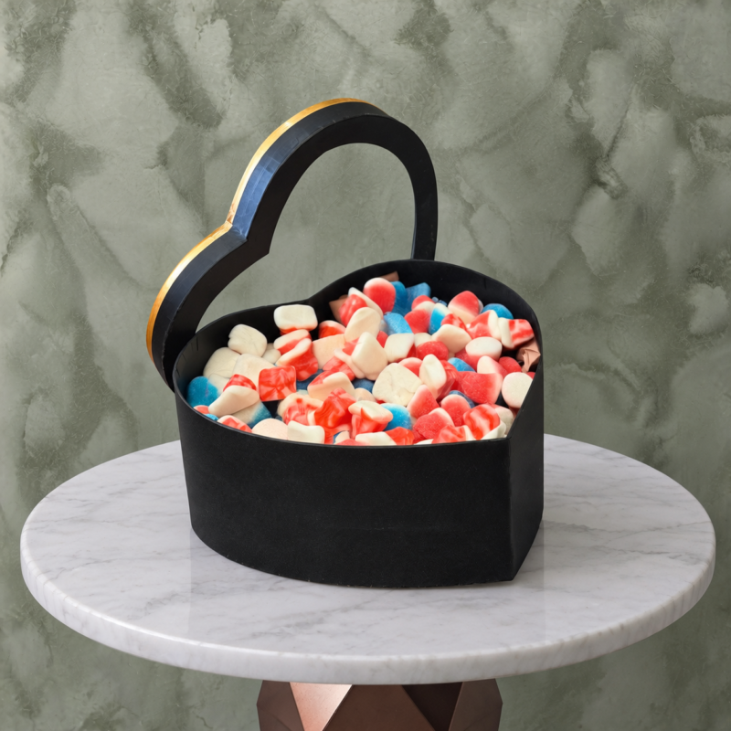 Black heart candy box amman featuring a 1kg assortment of colorful candies in a luxury heart-shaped box-بوكس قلب أسود كاندي في عمان