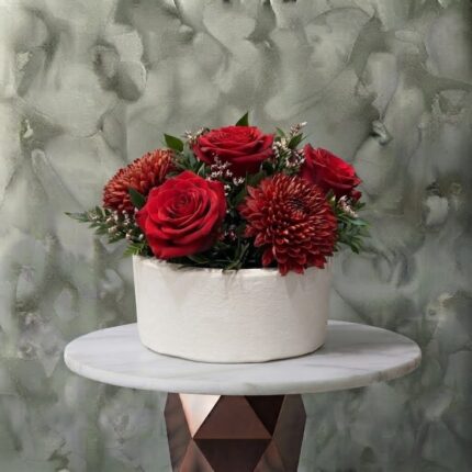 Royal valentine box amman arrangement featuring a stunning mix of red roses, textured chrysanthemums, and greenery in a modern white pot.