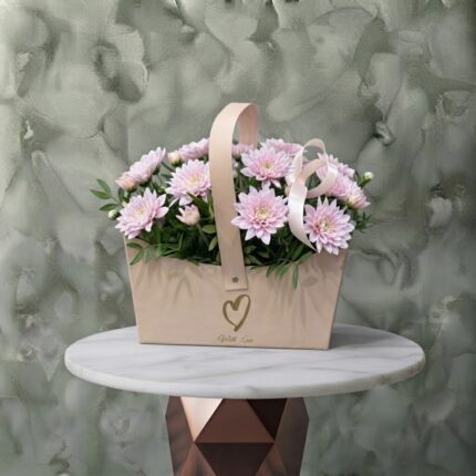 Love box amman arrangement featuring fresh pink chrysanthemums and greenery in a beige handle box decorated with a ribbon