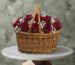 Twelve hearts amman red roses basket with 12 red roses and white baby's breath in a woven wicker basket with handles.