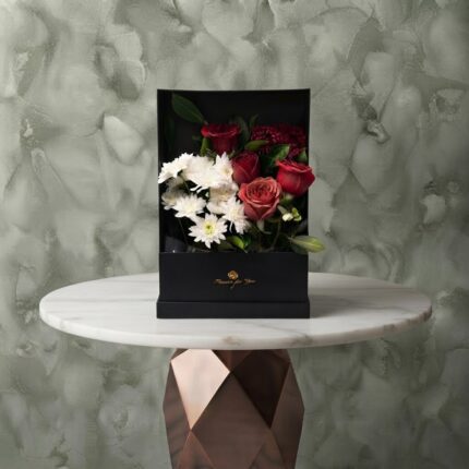 Passion canvas amman arrangement featuring a stunning mix of red roses and white flowers inside a modern black frame box. لوحة الشغف
