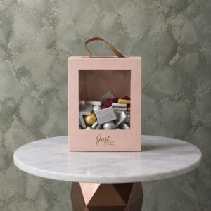 Bella luxury chocolate box 1kg featuring assorted chocolates in a pink handle box with Just For You text.صندوق شوكولاتة بيلا