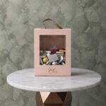 Bella luxury chocolate box 1kg featuring assorted chocolates in a pink handle box with Just For You text.صندوق شوكولاتة بيلا