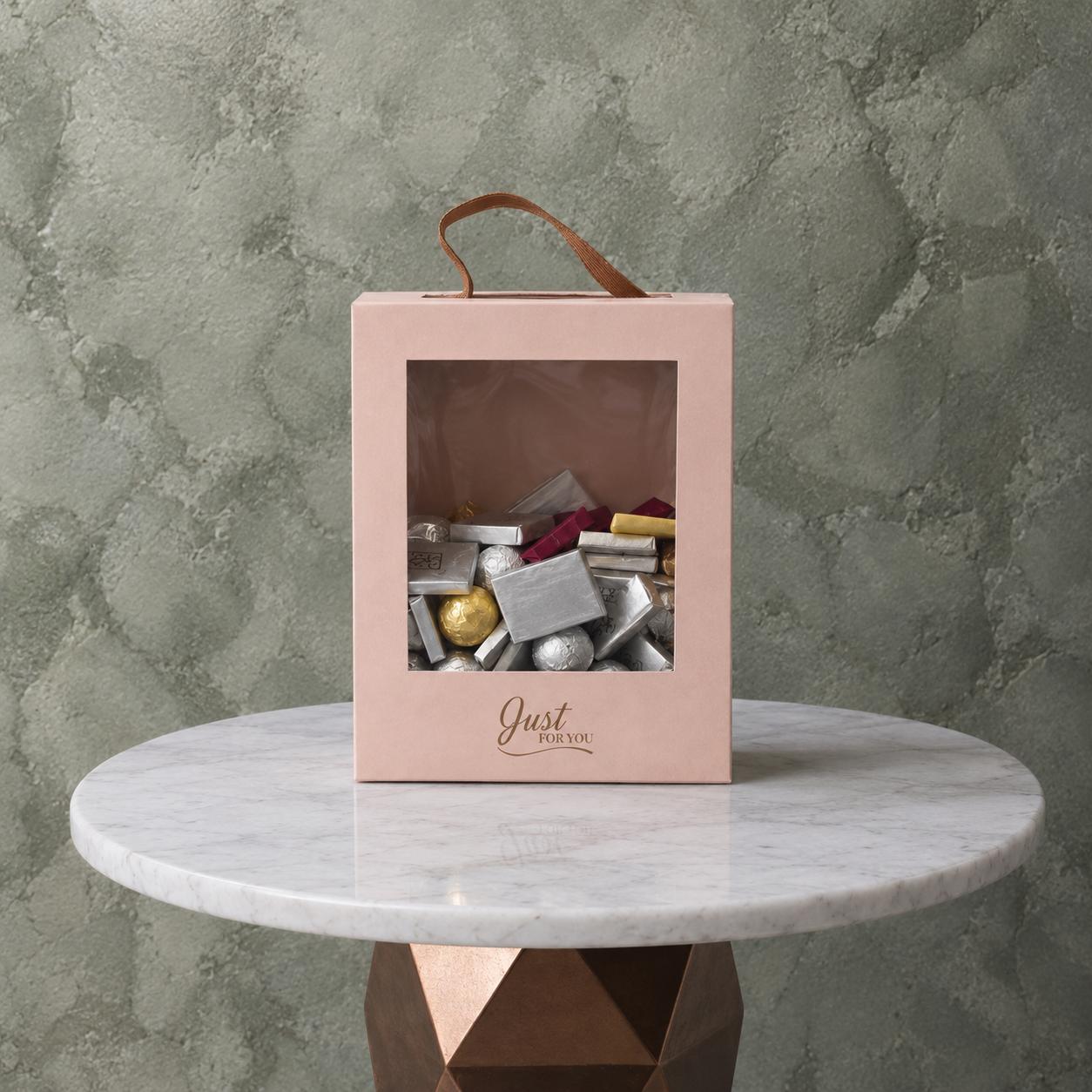 Bella Luxury Chocolate Box 1kg - صندوق شوكولاتة بيلا Bella luxury chocolate box 1kg featuring assorted chocolates in a pink handle box with Just For You text.صندوق شوكولاتة بيلا